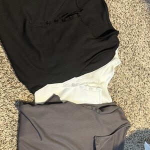 Black, White, and Gray Button-Up Shirts